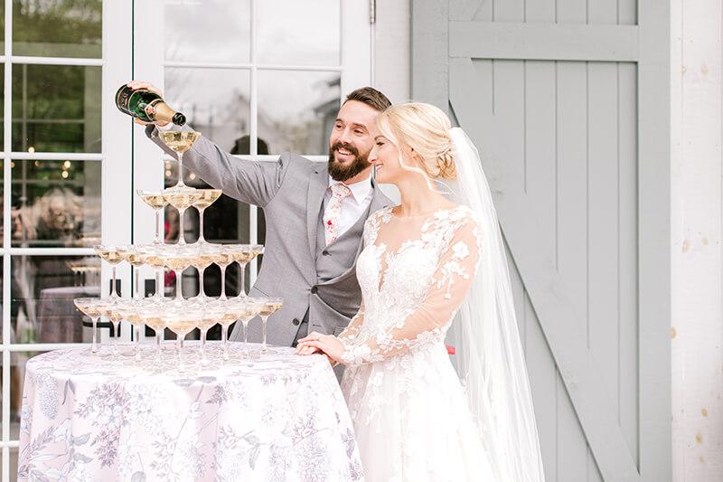 Bride and groom with champagne tower