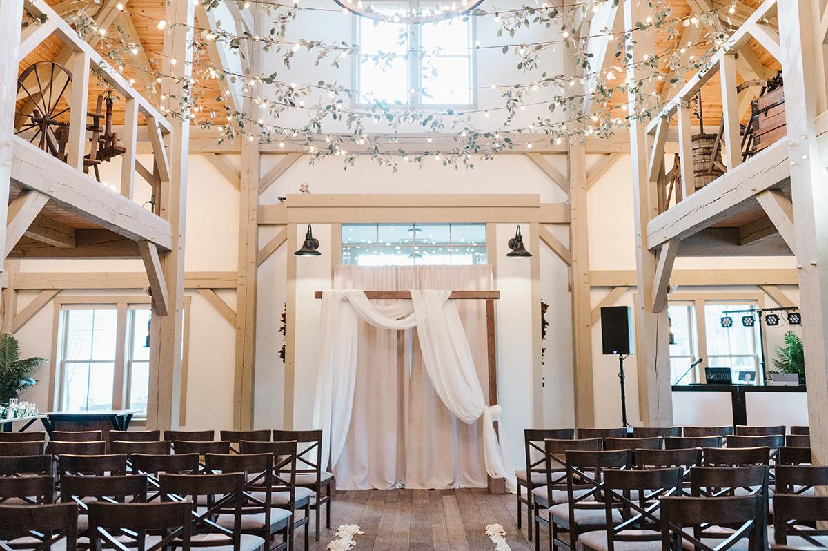 Wedding ceremony with florals and lights