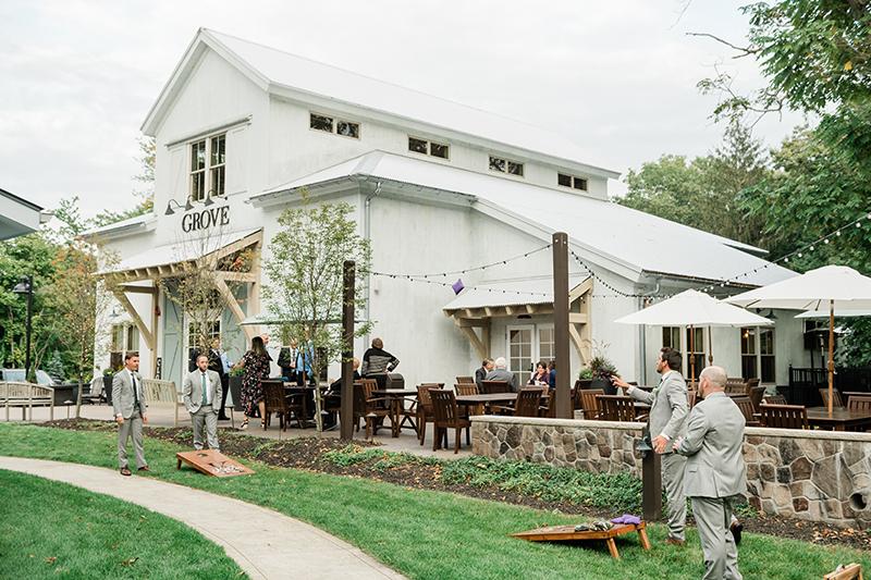 Groomsmen playing lawn games