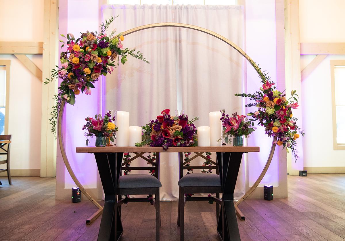 Sweetheart table with arbor