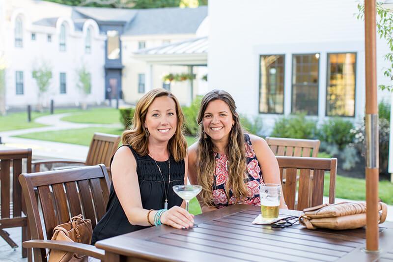 Friends having drinks on outdoor patio