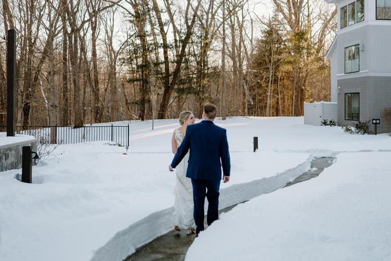 Couple walking through snow path