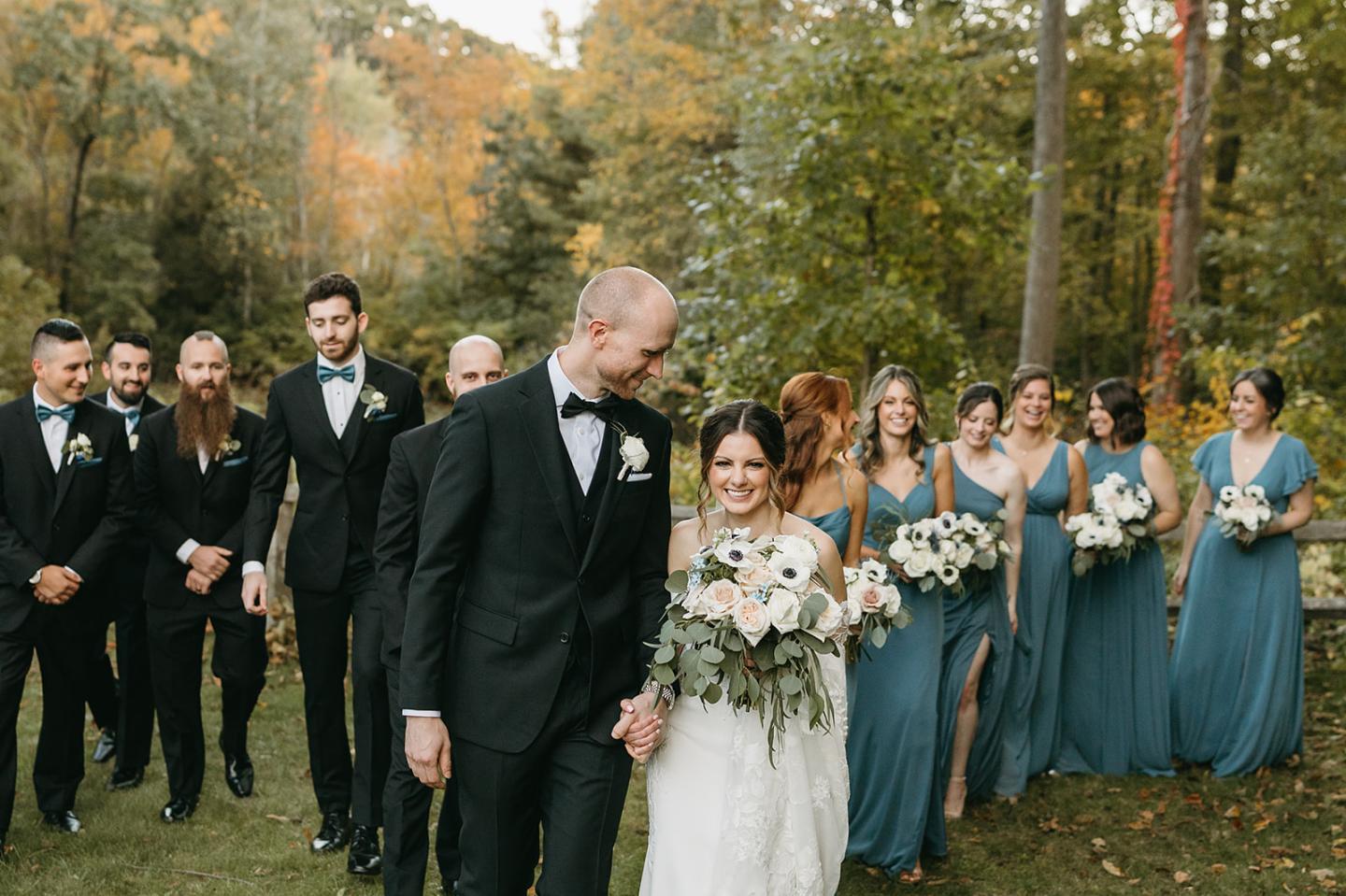 wedding party in the woods during fall