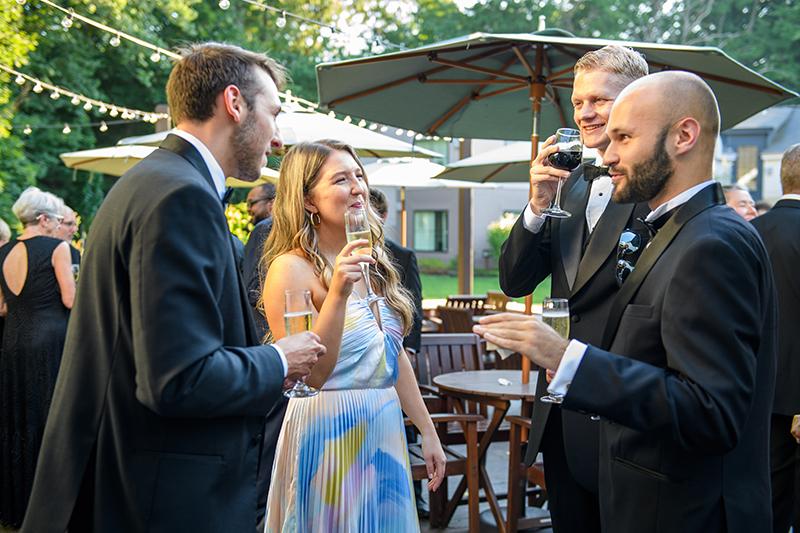 Guests at cocktail hour on patio