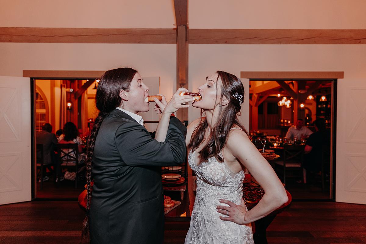 Brides feeding each other dessert