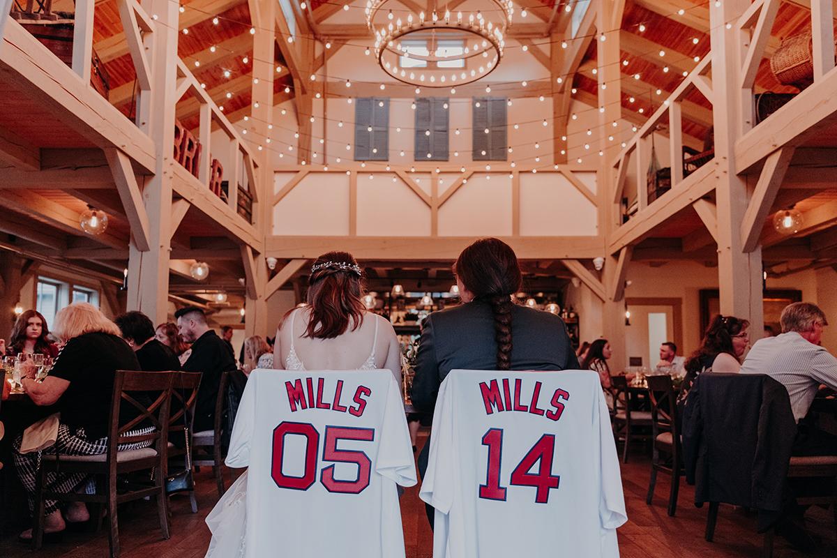 Brides at sweetheart table with jerseys