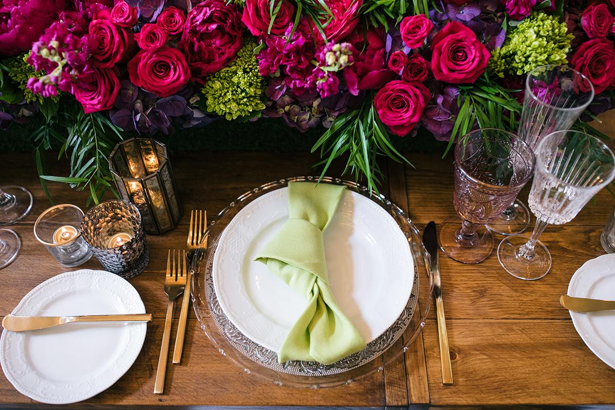 Tablescape with linens and gold flatware