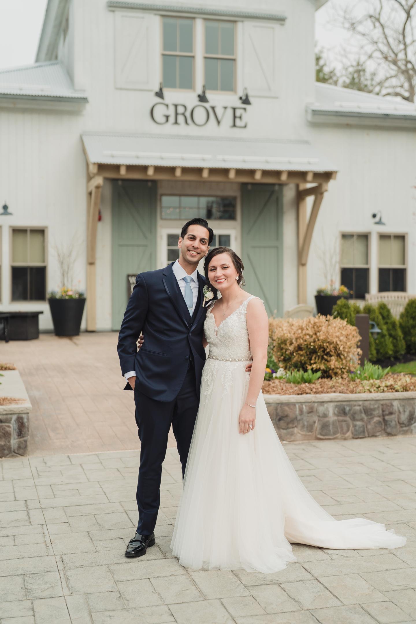 couple in front of grove