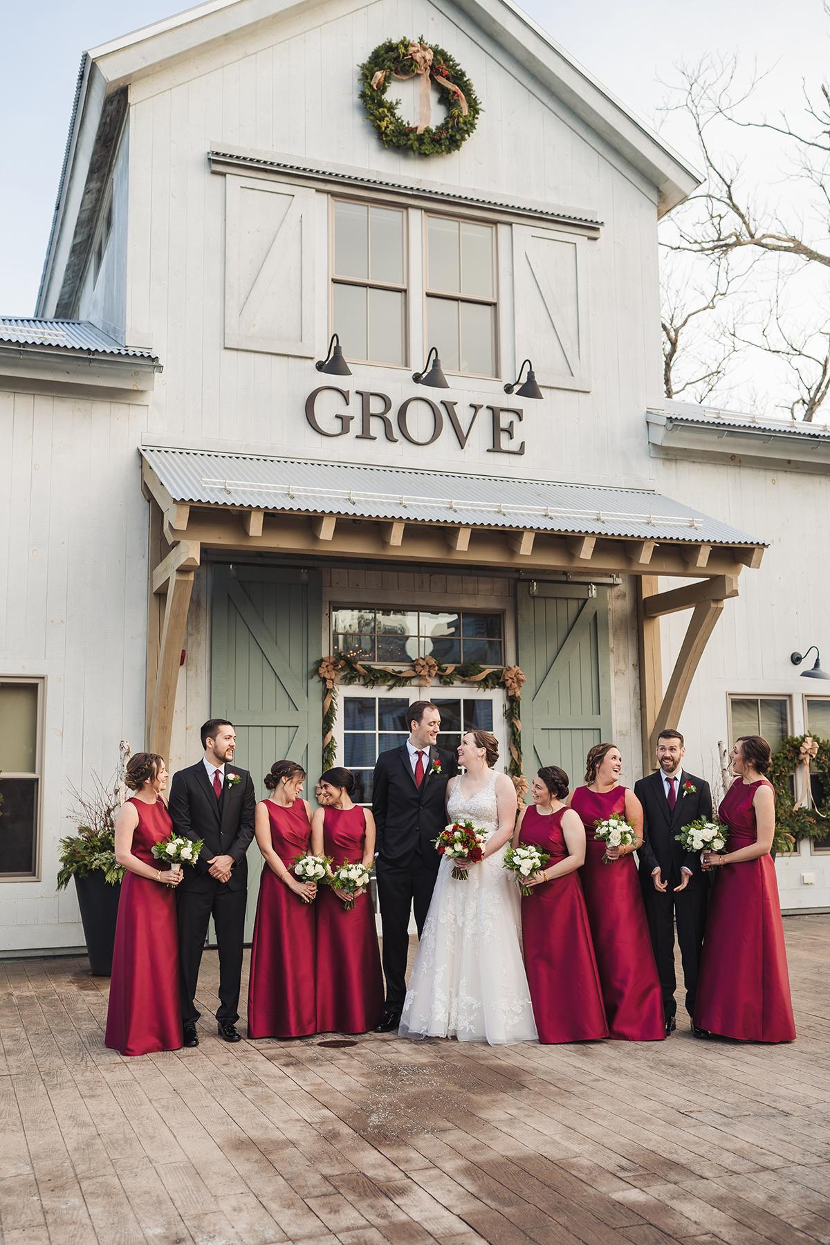 wedding party in front of grove