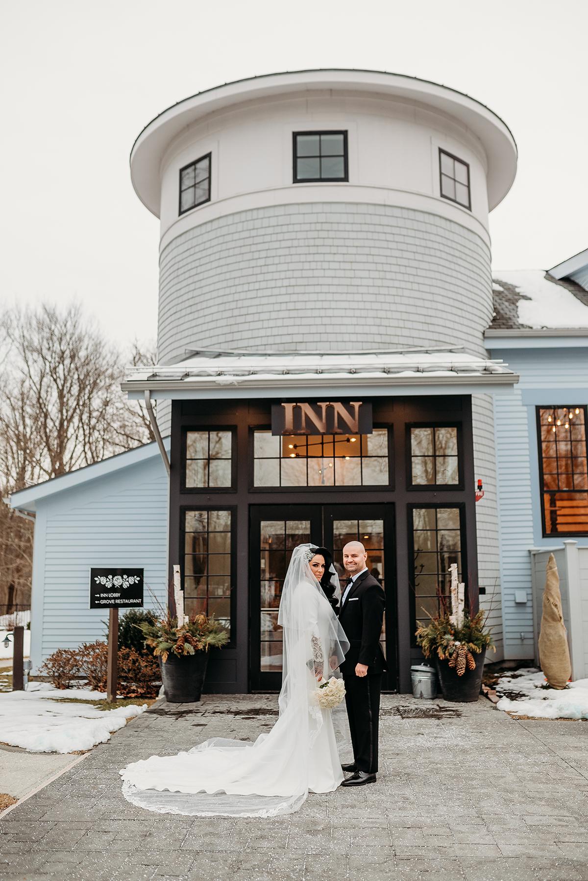 couple in front of inn