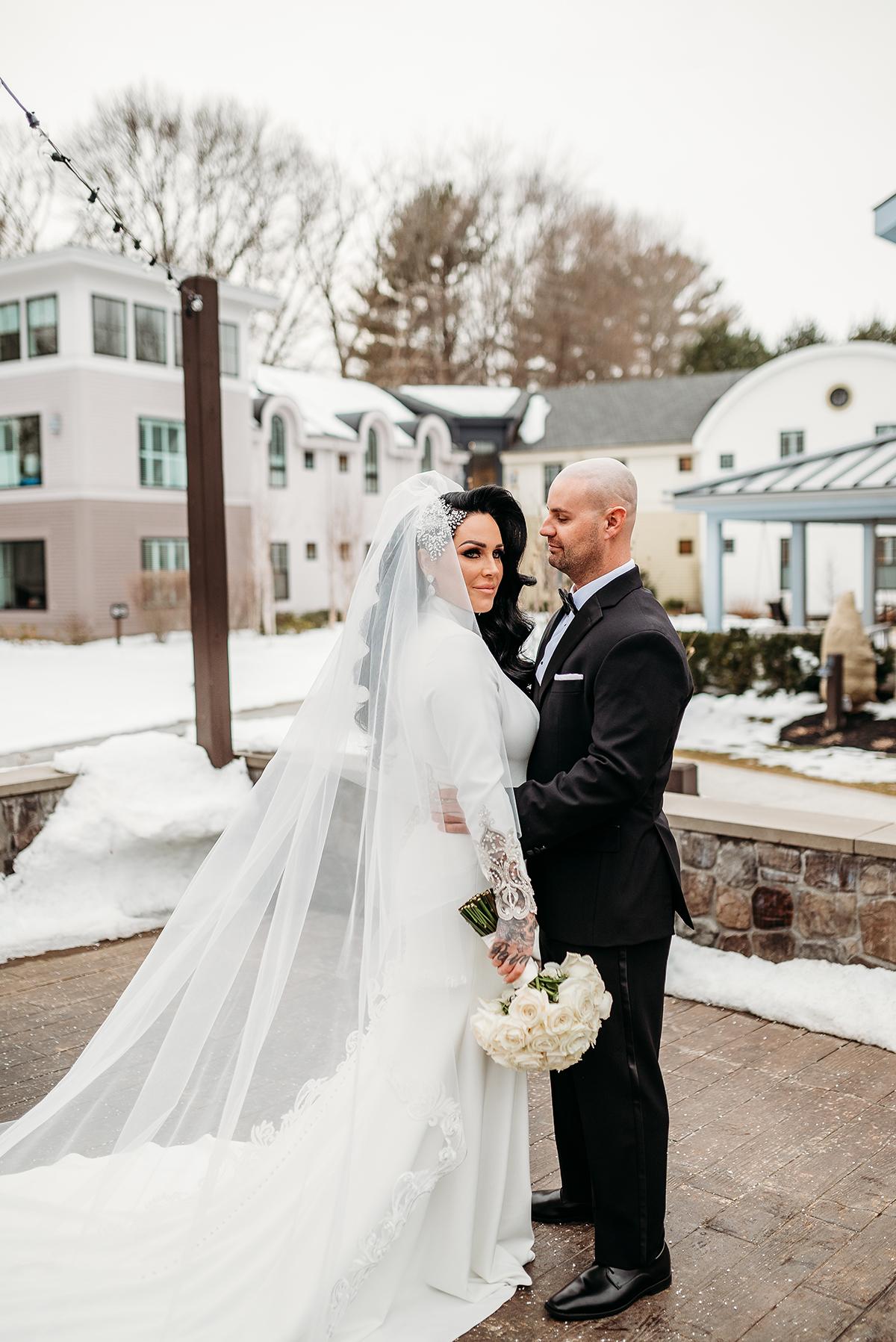 couple in snowy courtyard