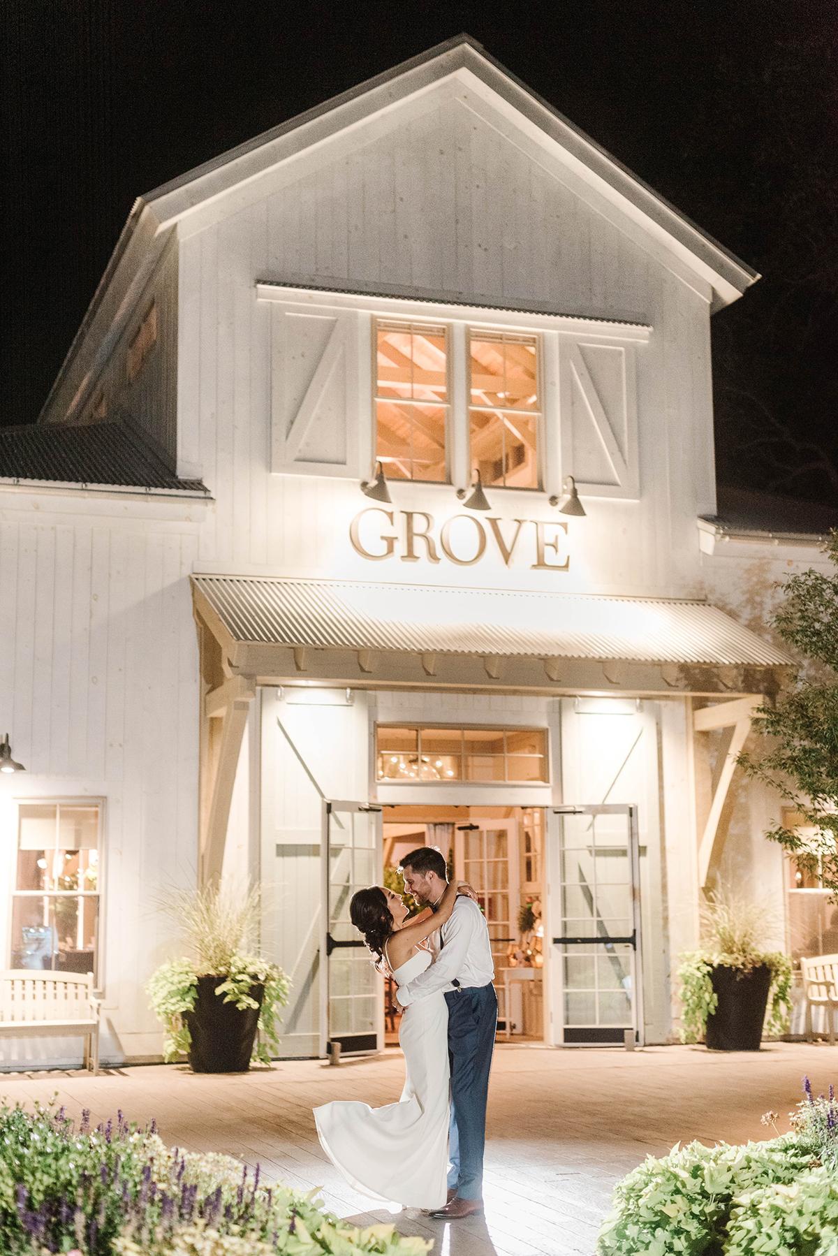 couple in front of inn at night