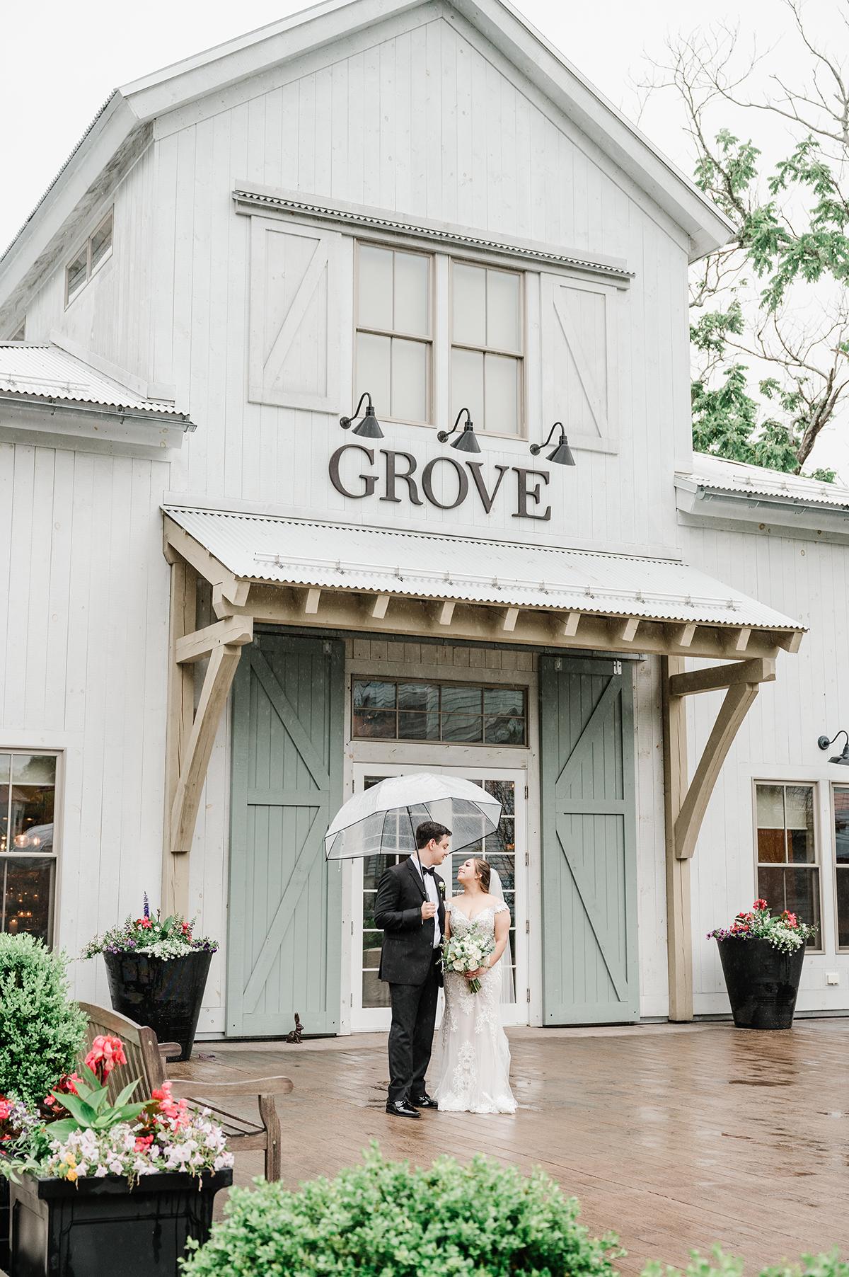 couple in front of grove