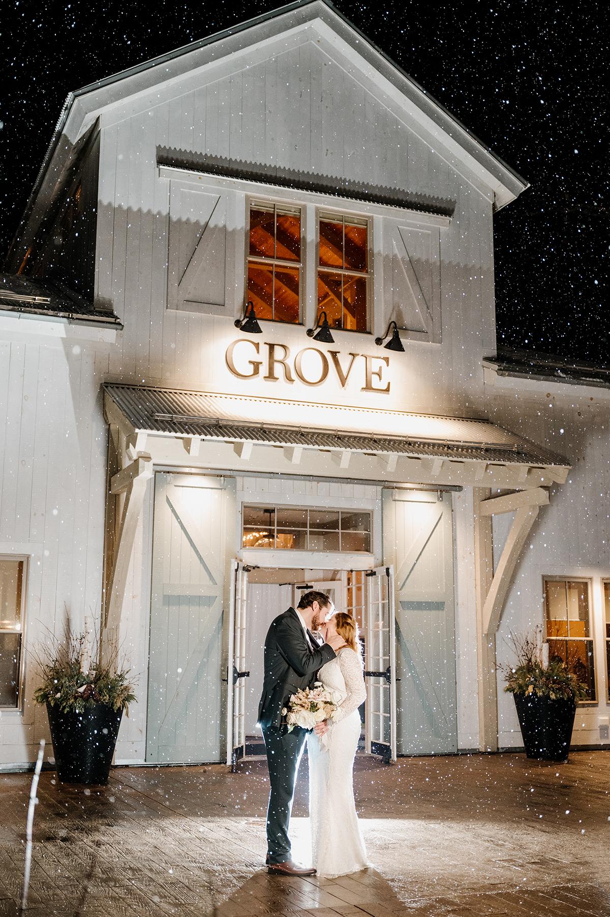couple in front of grove