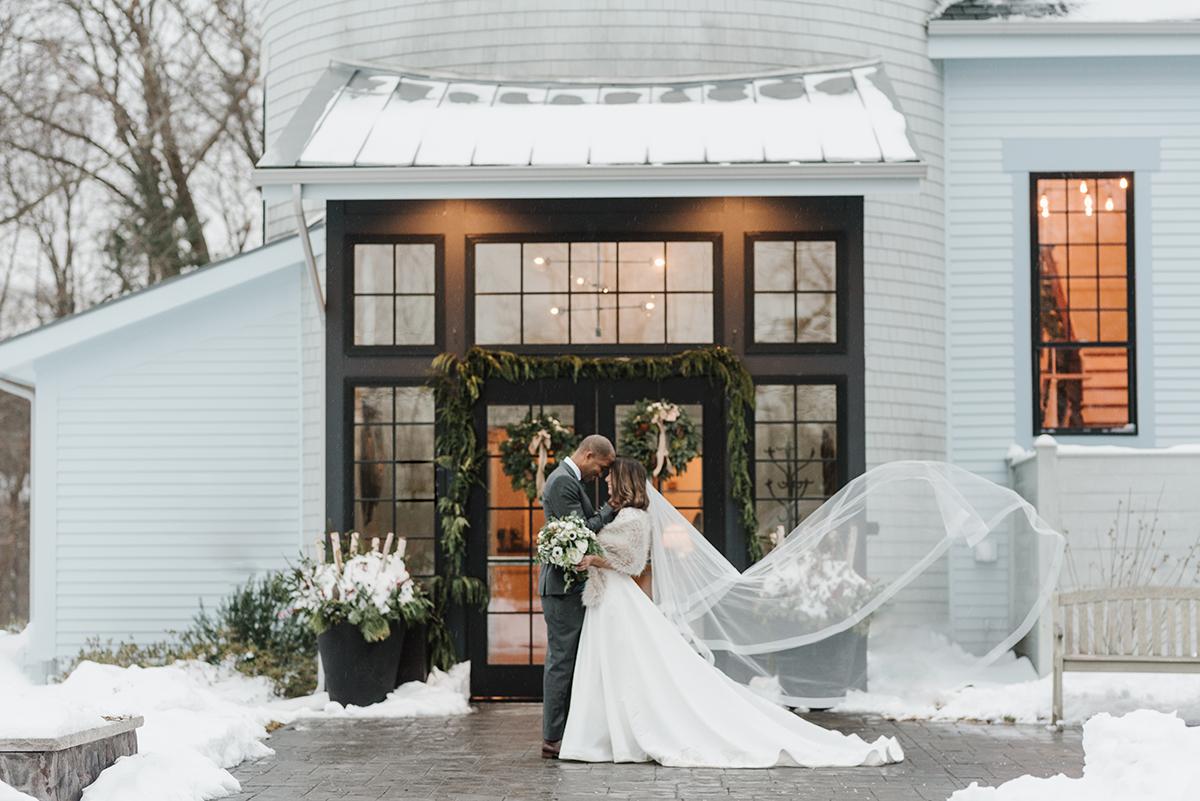 couple in front of inn