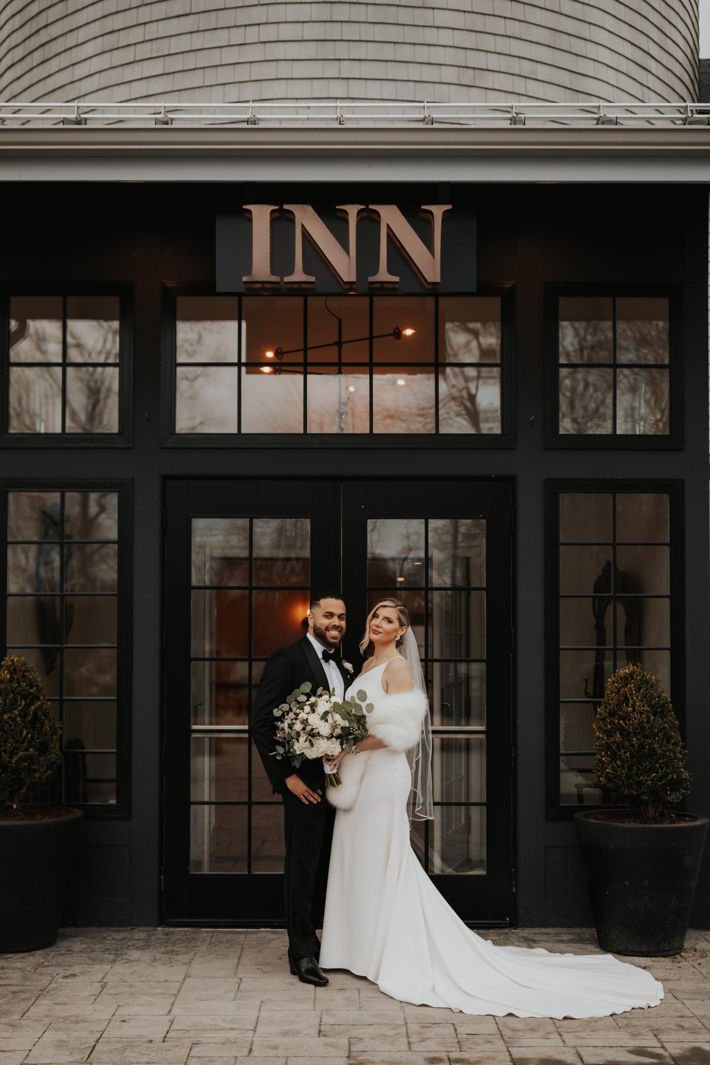 couple in front of inn