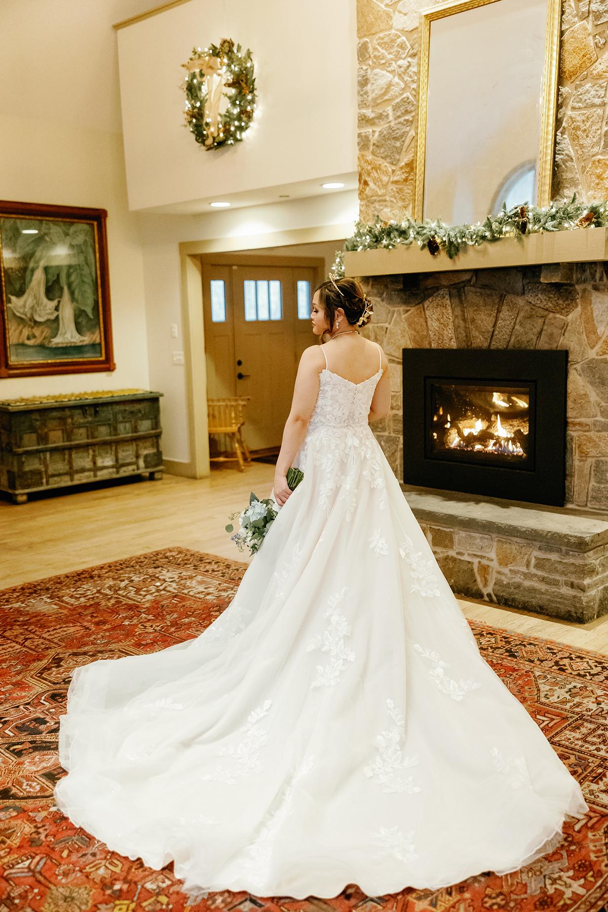 bride next to fire place 