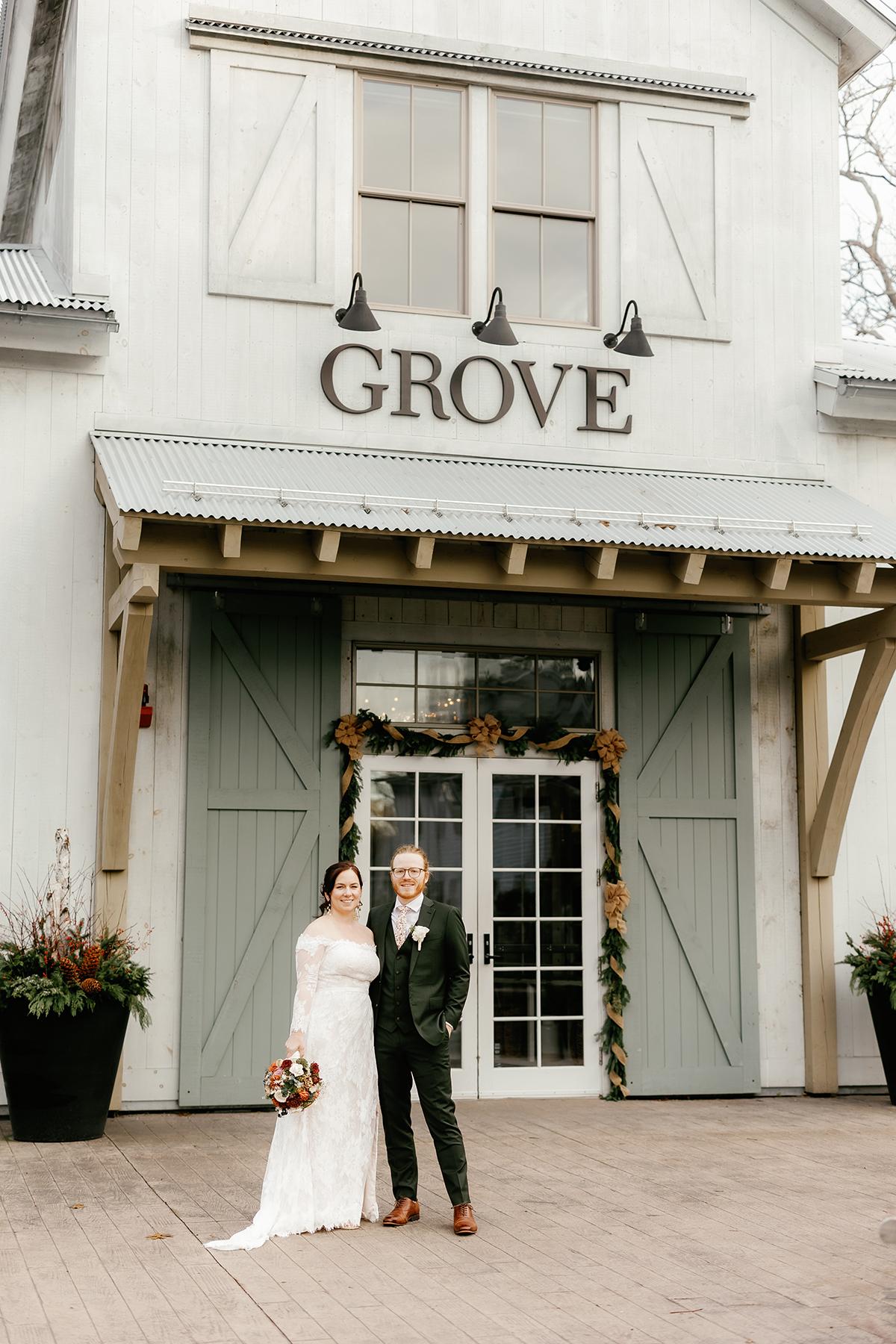 couple in front of grove