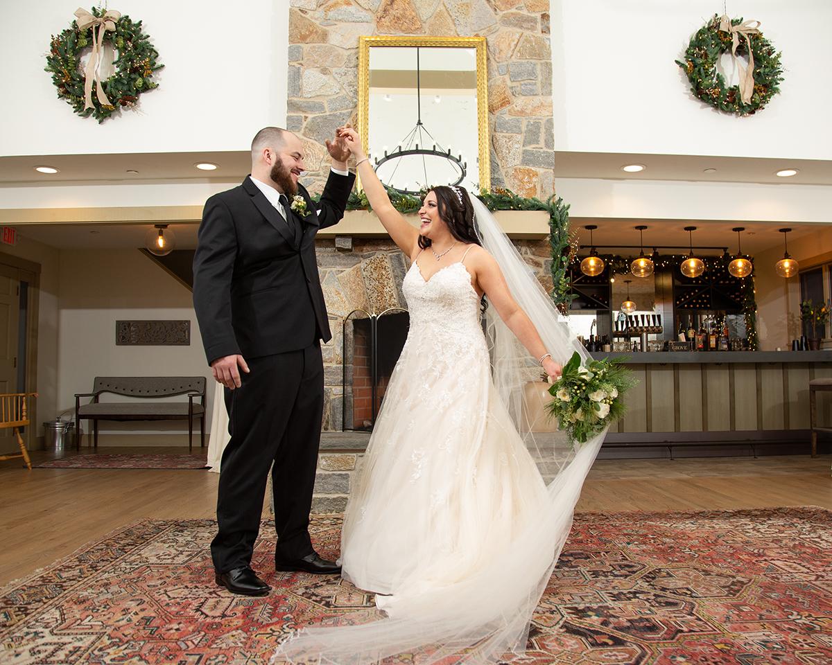 couple in front of fire place