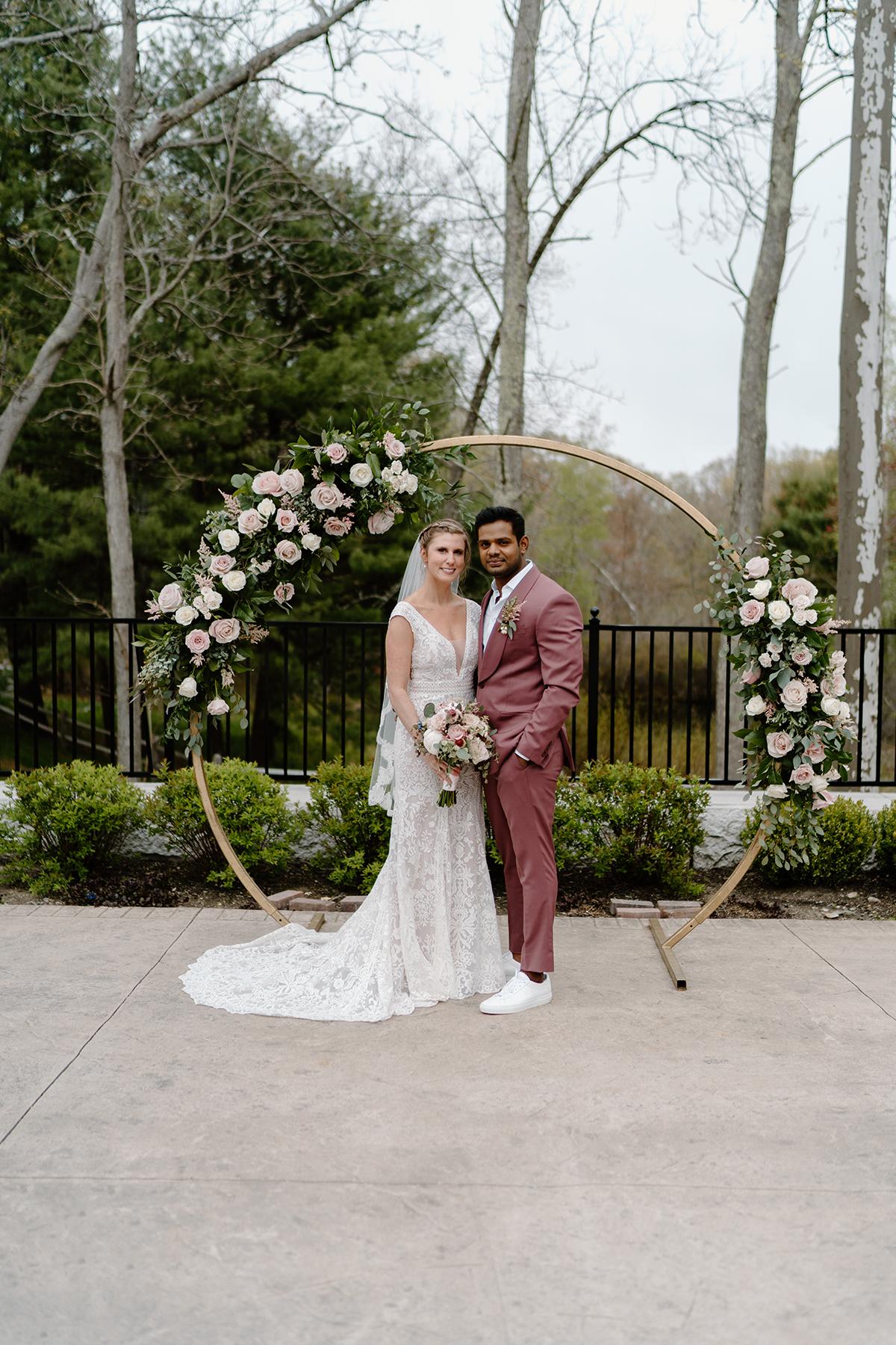 couple in front of arbor