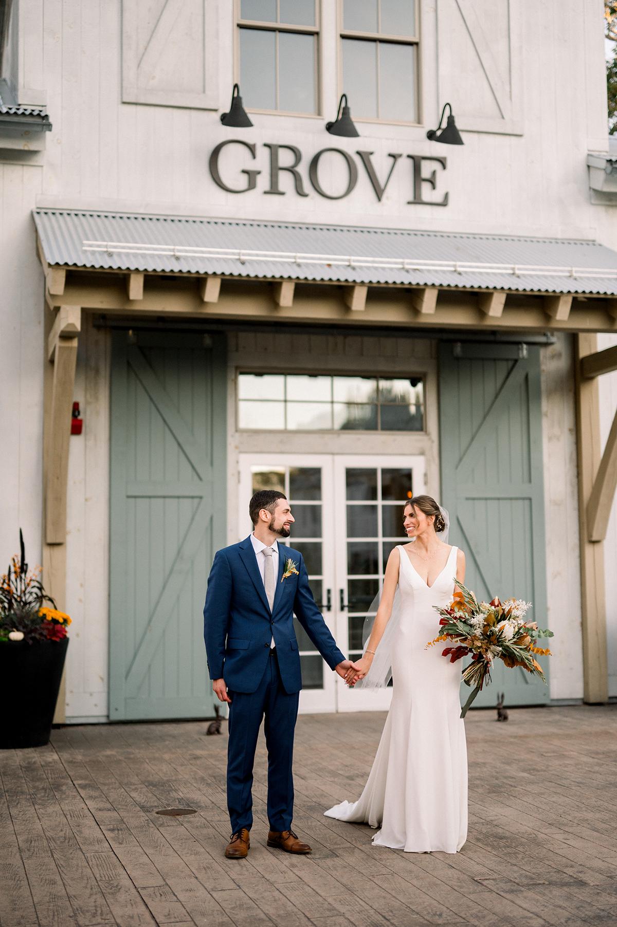couple in front of grove