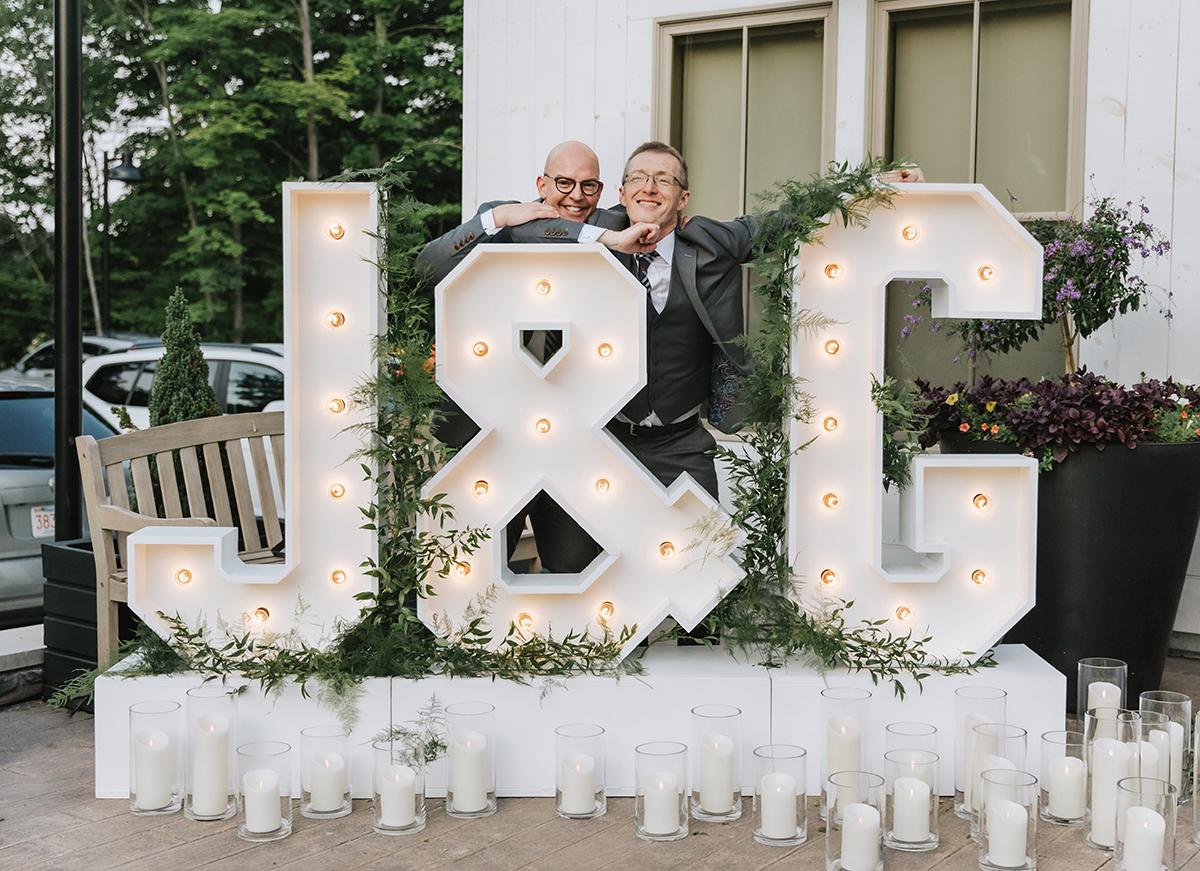 couple with neon letters