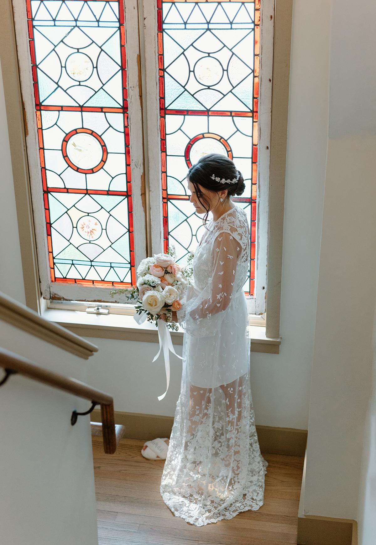 bride next to stained glass window