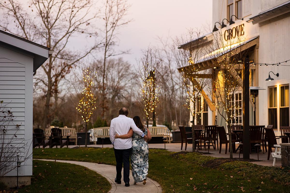couple in front of grove