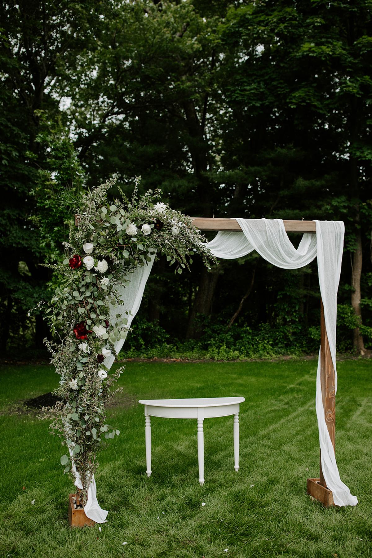 arbor with draping and florals