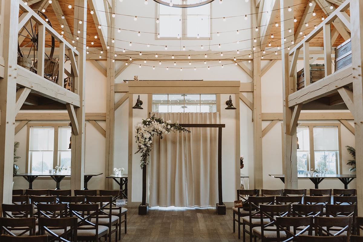 Beautiful barn wedding venue with rustic decor and string lights.