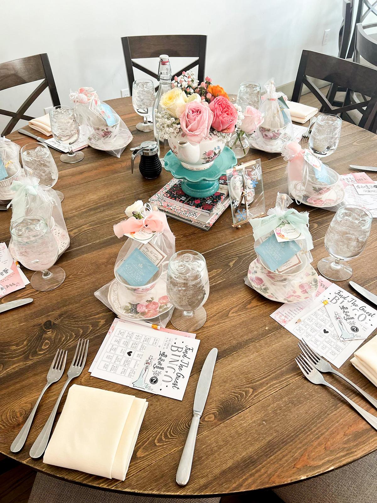 Elegant table setting with floral centerpiece and pastel decorations.