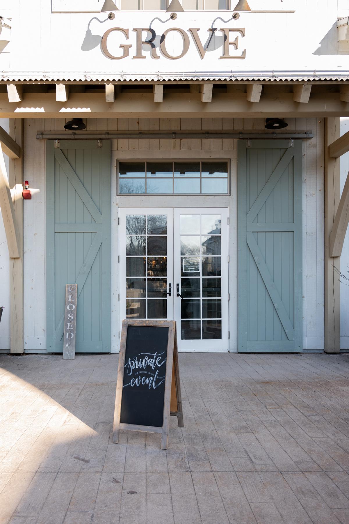 Restaurant entrance with a chalkboard sign outside.