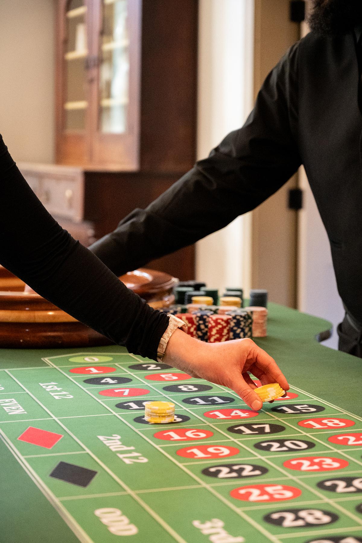 Roulette table with chips being placed by players.