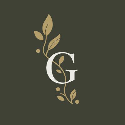 White monogram G with golden leafy branches on dark olive background